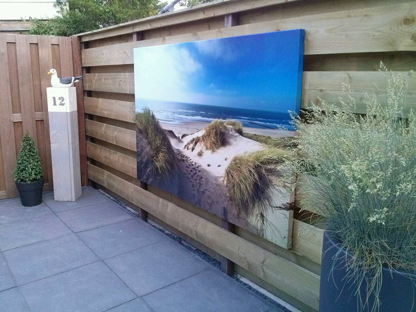 Uw tuin veranderen met een tuinposter in een strand thema